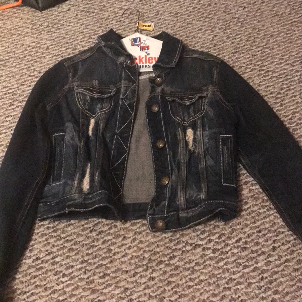 Dark blue jean jacket with long sleeves